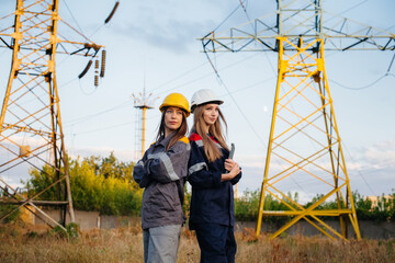 Women's collective of energy workers conducts an inspection of equipment and power lines. Energy