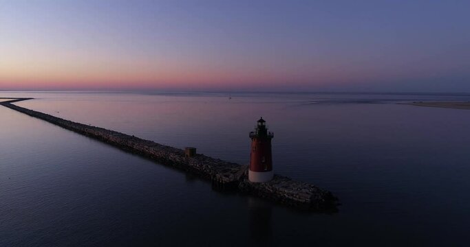 Colorful sunset over the Delaware Bay with Delaware Breakwater, aerial drone footage