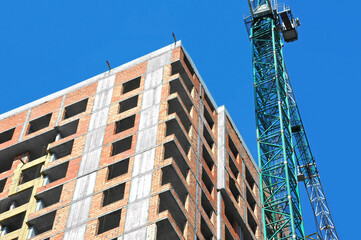 Crane and highrise construction site