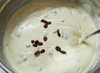 Curd mass and yolk with raisins