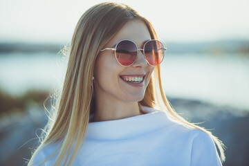 Sunny portrait of young beautiful woman