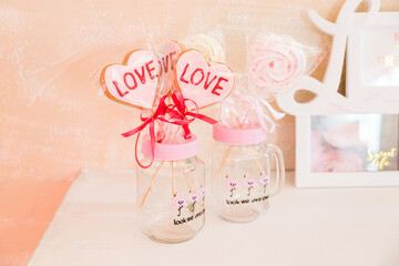 Sweets on a stick in a transparent glass jar valentine's day decoration