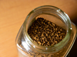 Instant coffee in a transparent glass bottle