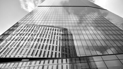 Fototapeta premium Abstract modern architecture with high contrast black and white tone. Architecture of geometry at glass window - monochrome. Black and white.