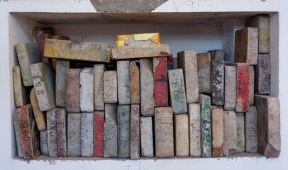 colorful engraving stones piled on a shelf