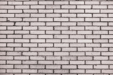An abstract, old, beige brick wall, can be used as a background