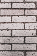 An abstract, old, beige brick wall, can be used as a background