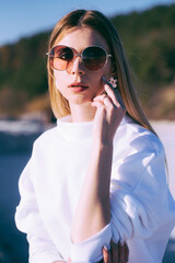 Sunny portrait of young beautiful woman