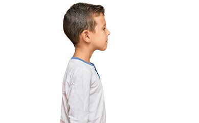 Adorable caucasian kid wearing casual clothes looking to side, relax profile pose with natural face...
