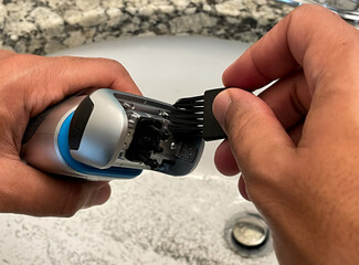 Cleaning the electric shaver with the brush