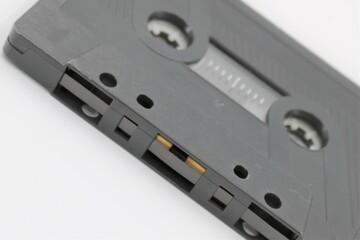 Audio tape cassette on white background.
