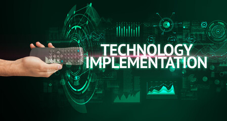 hand holding wireless peripheral with TECHNOLOGY IMPLEMENTATION inscription, modern technology...