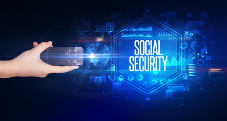 hand holding wireless peripheral with SOCIAL SECURITY inscription, cyber security concept
