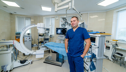 Doctor on operating room background. Modern interior of up to date surgery room.