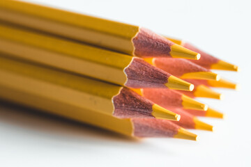 Yellow pencils on a white background. Office, drawing.