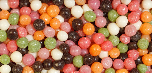 Round colored candies for background.