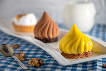 
Three fresh cakes on a white plate