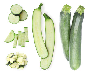Set of fresh ripe zucchinis on white background, top view