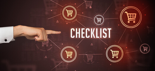 Close-Up of cropped hand pointing at CHECKLIST inscription, online shopping concept