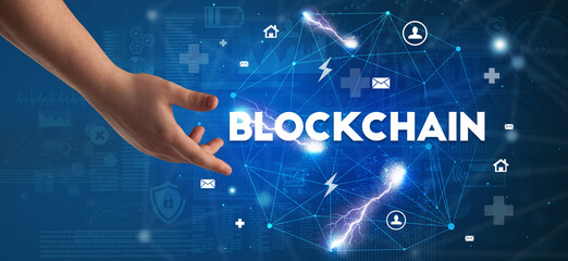 Hand pointing at BLOCKCHAIN inscription, modern technology concept