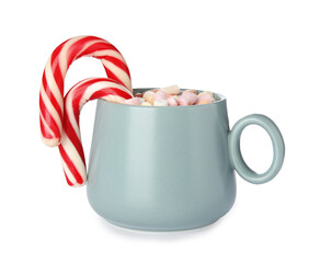 Cup of tasty cocoa with marshmallows and Christmas candy canes isolated on white