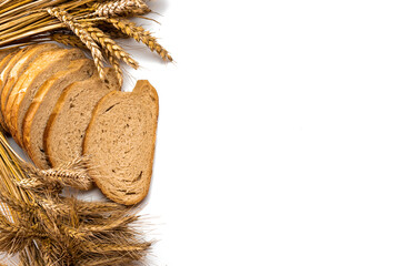 Whole wheat bread. Fresh loaf of rustic traditional bread with wheat grain ear or spike plant...