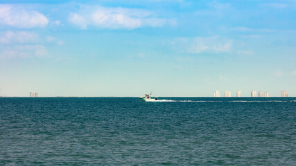 Boat rides over San Carlos Bay background Fort Myers Beach