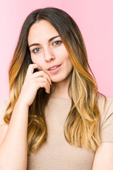 Fototapeta premium Young beautiful woman isolated on pink background