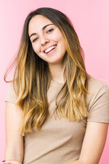 Fototapeta premium Young beautiful woman isolated on pink background