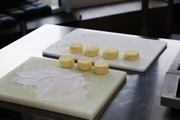 making curd cheese cakes in the kitchen