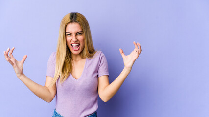 Young blonde caucasian woman screaming with rage.