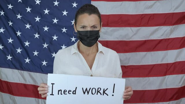 Unemployed during coronavirus. A workless woman in medical protective mask look for a job during pandemic crisis in the world. A concept of work problems in America.