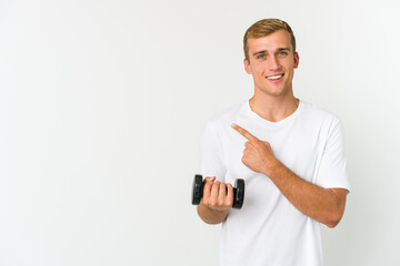 Young caucasian man holding a weight isolated on white background