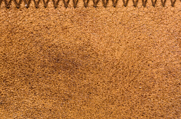 Old vintage genuine soft brown leather texture background, top layer with pores and scratches,...