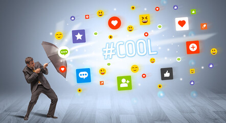 Handsome businessman defending with umbrella from #COOL inscription, social networking concept