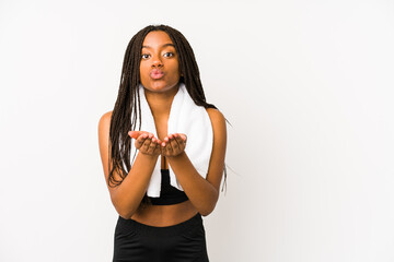 Young african american sport woman isolated folding lips and holding palms to send air kiss.