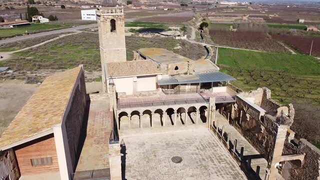 View from drone of ancient ruined monastery of Avinganya near Catalan city of Seros on spring sunny day, Spain