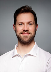 Application photo of young white male with beard on grey Background