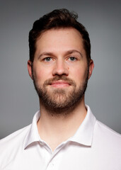 Application photo of young white male with beard on grey Background