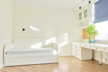 Pastel light interior of child's room for girl, white furniture