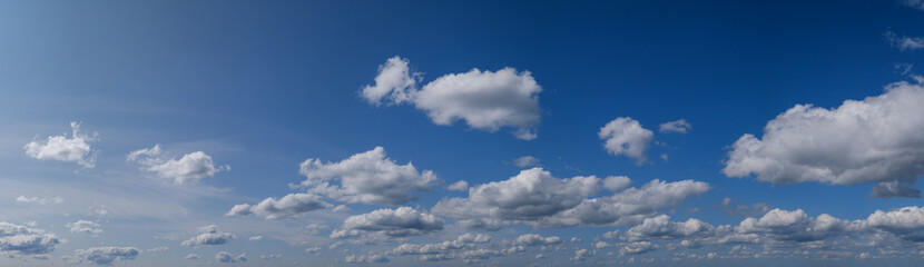 Fototapeta na wymiar Blue sky with clouds in sunshine (wide natural cloudscape background panorama)