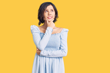 Young beautiful girl wearing casual clothes thinking worried about a question, concerned and nervous with hand on chin