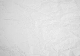 white and gray crumpled paper texture background. crush paper so that it becomes creased and wrinkled.