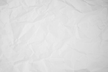 white and gray crumpled paper texture background. crush paper so that it becomes creased and wrinkled.