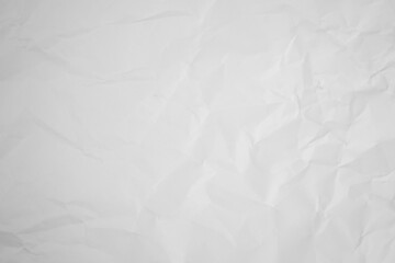 white and gray crumpled paper texture background. crush paper so that it becomes creased and wrinkled.