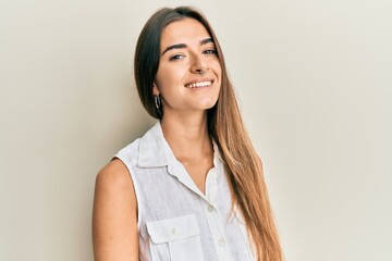 Young hispanic girl smiling happy standing over isolated white background.