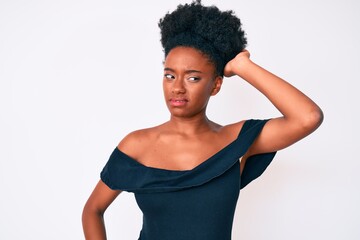 Young african american woman wearing casual clothes confuse and wonder about question. uncertain...