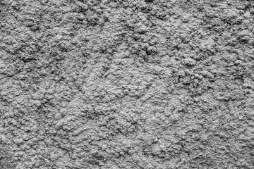 a very uneven gray wall. Hard background or texture. Wide