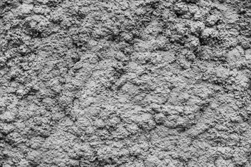 a very uneven gray wall. Hard background or texture. 