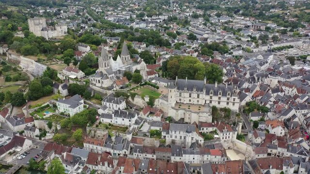 Scenic drone view of medieval fortified castle with royal residence and St Ours church in historic French town of Loches in summer